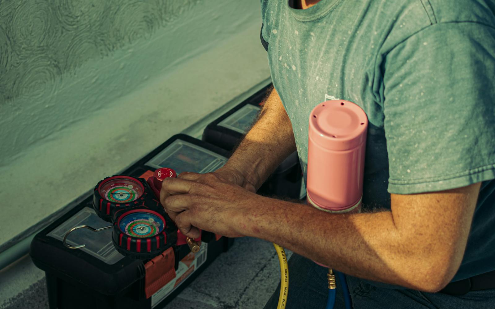 MajorHVAC maintenance visit showing gauges and tools near HVAC equipment.